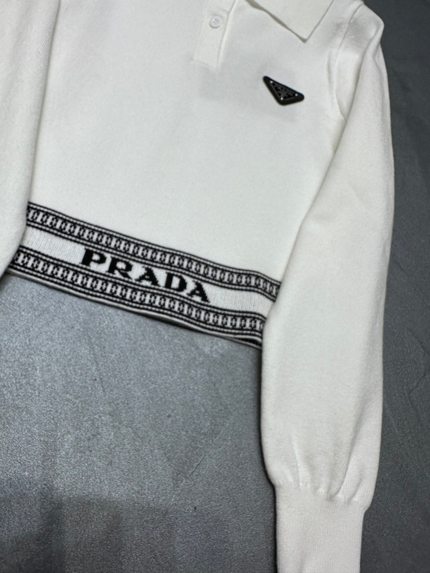 Triangle logo polo collar hem jacquard long-sleeved sweater