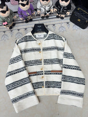 Round neck black and white striped single-row metal button pattern jacket